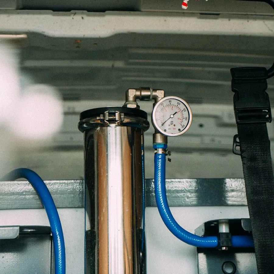 Pure water filtration vessel and pressure gauge inside the Ant Burton van